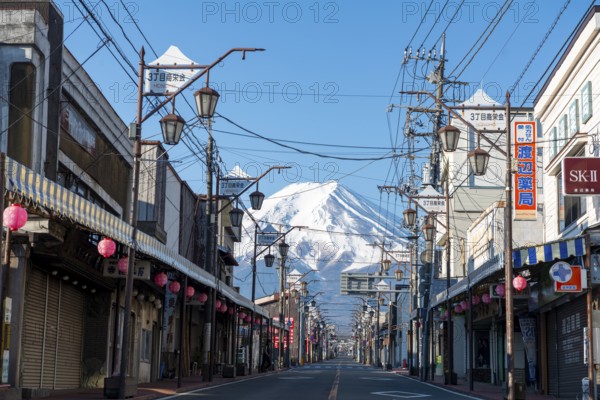 Road through the Japanese town of Fujiyoshida, behind the volcano Mt. Fuji, Yamanashi Prefecture, Japan