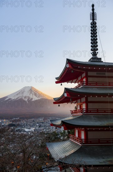 Five-story pagoda of a Shinto Shrine, Chureito Pagoda, with views of Fujiyoshida City and Mount Fuji volcano at sunset, Arakura Fuji Sengen Shrine, Arakurayama Sengen Park, Yamanashi Prefecture, Japan