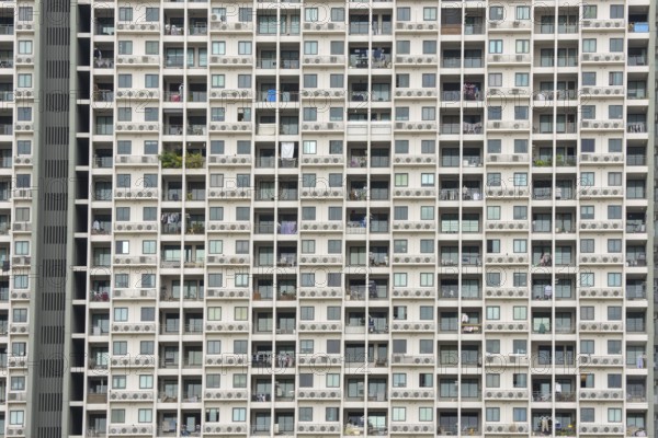 Exterior façade of a residential high-rise building of Condo U (a brand or series name of the Thai real estate developer Grand Unity Development Co., Ltd. (often abbreviated Grand U), Bangkok Yai district, the old town of Bangkok, Thailand