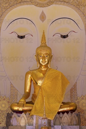Golden Buddha statue with tunic, Bhumispara mudra, Buddha Gautama at the moment of enlightenment, art hall with exhibition of non-traditional works of art, most of which follow modern art trends such as minimalism and abstraction, Wat Sitthawararam, Bangkok, Thailand