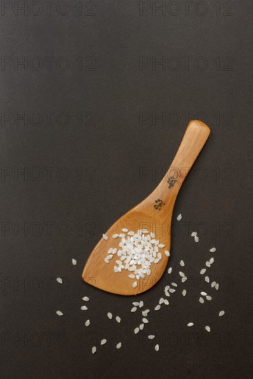 Rice grains with cooking spoon, rice