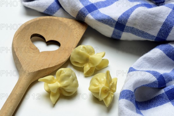 Saccottini, type of Italian pasta and cooking spoon with heart, pasta from Italy