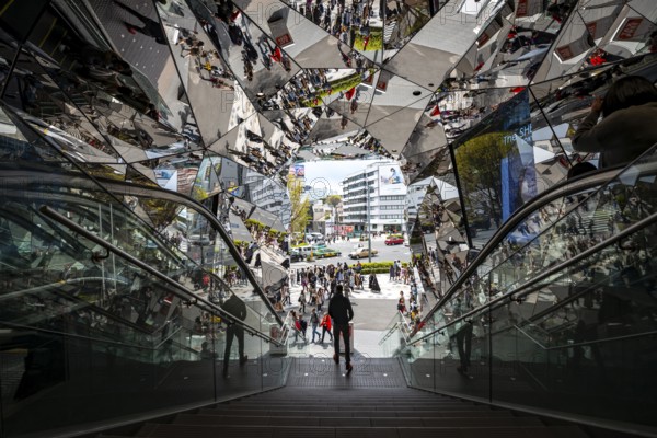 Young man on a stairway, entrance to a shopping center with many mirrors, Tokyu Plaza Omotesando Harajuku, modern architecture, Tokyo, Japan