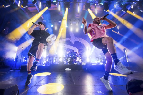 Carlito (Carlos Charlemoine) and Mal Élevé (Pablo Charlemoine), singers from Irie Révoltés live on Irieunion - Le Re-Tour pour une année! Tour in Berlin's Columbiahalle on 31.10.2025