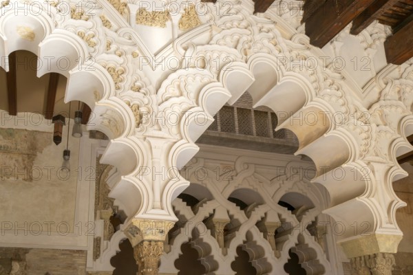 Ornate Islamic design of decorated Moorish arches, Aljafería Palace, Zaragoza, Aragon, Spain
