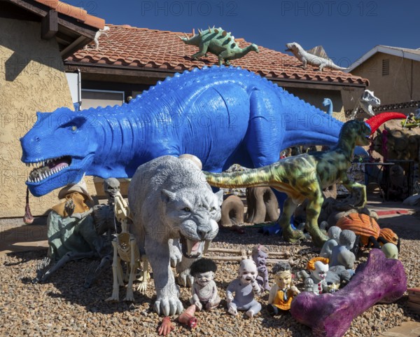 Henderson, Nevada - Dinosaurs dominate the yard of a house in suburban Las Vegas, placed there by retired school teacher Steve Springer