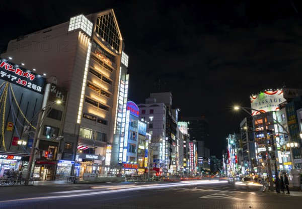 Street and neon sign, long exposure street scene at night, Tokyo, Japan