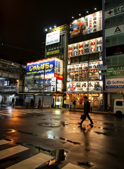 Street with illuminated shops at night in Akihabara, Electric City, Tokyo, Japan