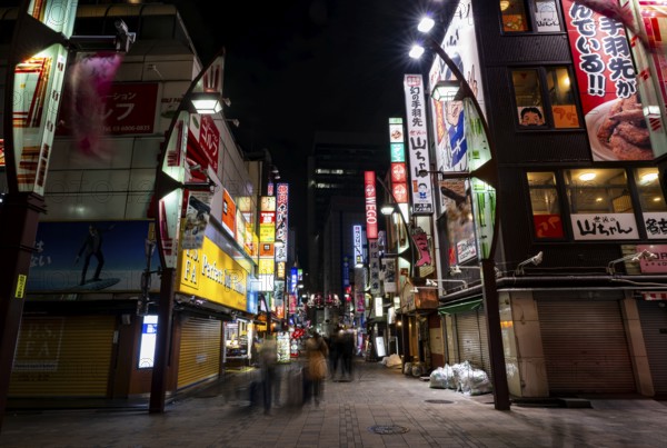 Pedestrian street with neon sign, long exposure, street scene at night, Tokyo, Japan