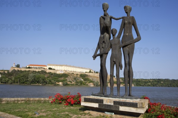 Memorial to the victims of the Novi Sad massacre, in the back the Petrovaradin Fortress or Petrovaradin on the Danube, Novi Sad, Vojvodina Province, Serbia