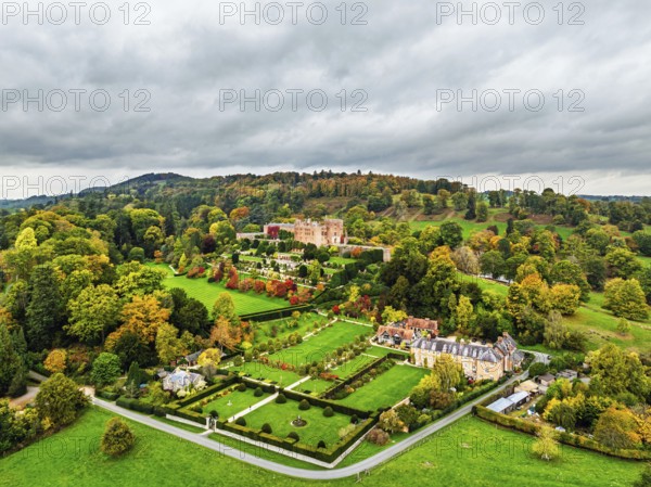 Autumn colours over Powis Castle and Garden from drone, Welshpool, Powys, Wales, England, United Kingdom