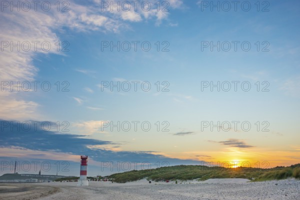 Red, white lighthouse Heligoland dune (Oberfeuer), striped, south beach, beach chairs, dunes, common beach oats (Ammophila arenaria (L.) Link, syn.: Calamagrostis arenaria (L.) Roth), wide sky, peaceful, in the background the main island, deserted, no one, warm, gentle sunlight at sunset, evening mood, relaxed atmosphere, atmospheric, colorful, quiet, vacation, summer, evening sun, Dune island, Heligoland, Pinneberg district, Schleswig-Holstein, North Sea, Germany