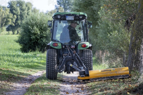 Landscape maintenance with tractor and mower, Darß, Mecklenburg-Vorpommern, Germany