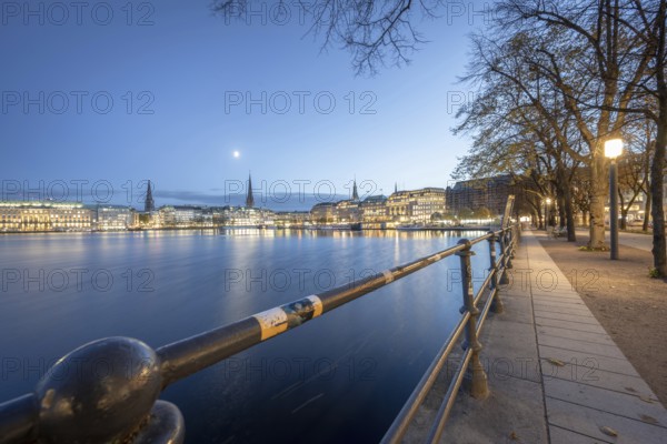 Inner Alster with footpath along Neuer Jungfernstieg at Blaue Stunde, Hamburg, Germany