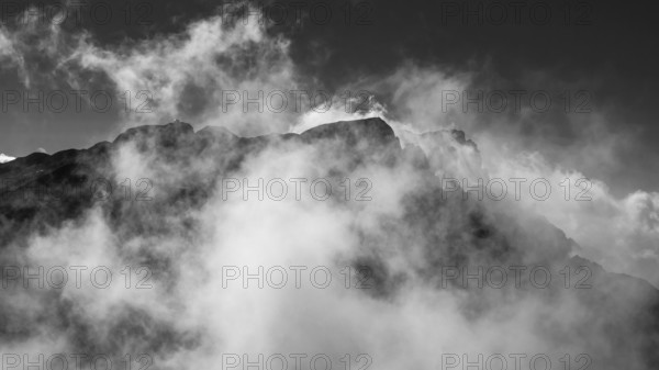 View from Brandhorn to the summit of the Hochkönig with the Matrashaus and atmospheric clouds, Steinernes Meer, Berchtesgaden Alps, Austria