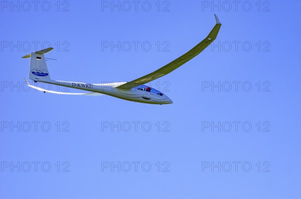 A Schempp-Hirth Arcus E motor glider, registration D-KWKU, during a screening as part of an air show at the Fliegerbergfest of the Rossfeld Luftsportverein in Metzingen-Glems, Baden-Württemberg, Germany, for editorial use only