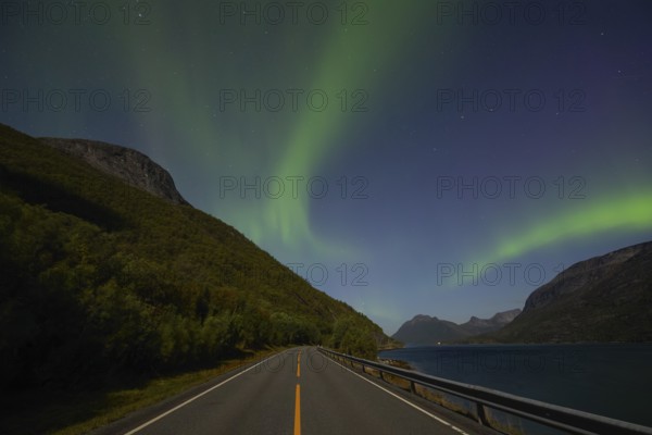 National mountain of Norway - Stetind in the Nordland under auroras and a full moon