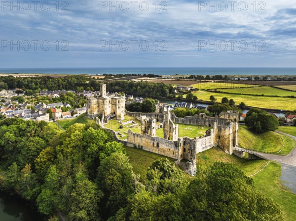 Warkworth Castle over River Coquet from a drone, Warkworth, Northumberland, England, United Kingdom