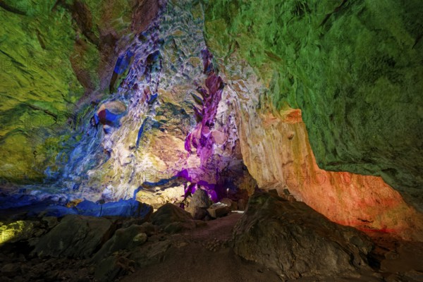 Coloured lighting, fog cave, stalactite cave in the Swabian Jura, stalactites, stalactite forest, interior view, Lichtenstein, Baden-Württemberg, Germany