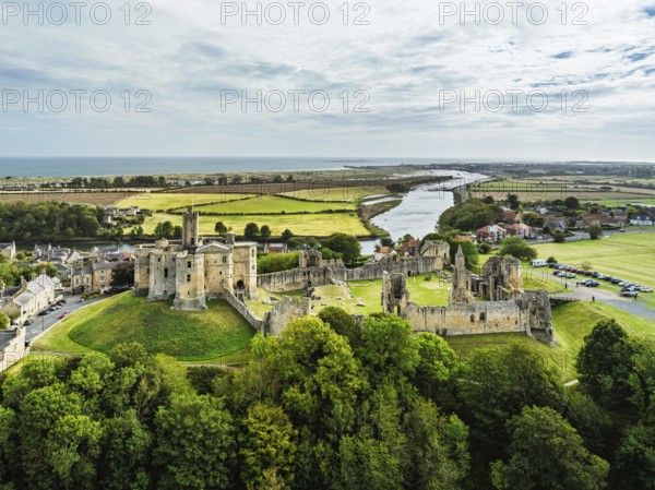 Warkworth Castle over River Coquet from a drone, Warkworth, Northumberland, England, United Kingdom