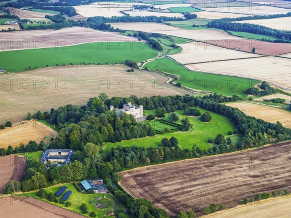 Wedderburn Castle and Barns over fields from a drone, Duns, Berwickshire, Scotland, UK
