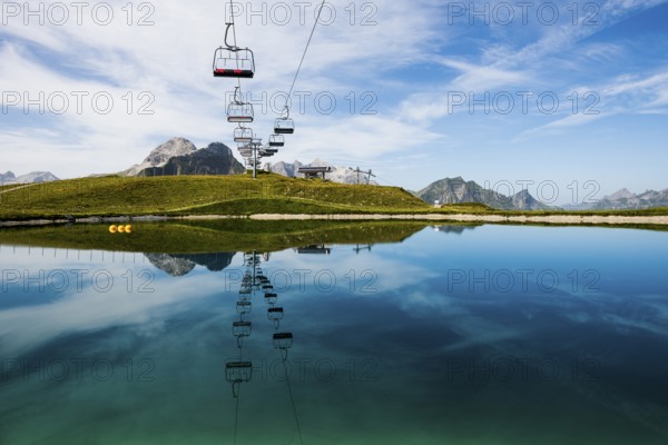 Mountain landscape with reservoir and chairlift, Saloberkopf, Warth, Bregenzerwald, Vorarlberg, Alps, Austria