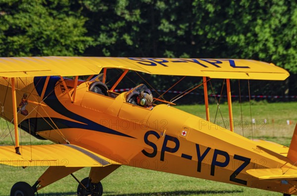 A biplane Bücker Bü 131 Jungmann with registration SP-YPZ during a flight demonstration as part of an air show on Rossfeld in Metzingen-Glems, Baden-Württemberg, Germany, for editorial use only