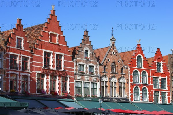 Historic houses on the market square in the old town of Bruges, Grote Markt, former guild houses, now restaurants and cafes, UNESCO World Heritage Site, Flanders, Belgium