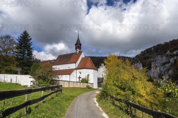 Käppeler estate with St. George's Basilica near Thiergarten in the upper Danube Valley, surrounded by autumn vegetation, Sigmaringen district, Baden-Württemberg, Germany