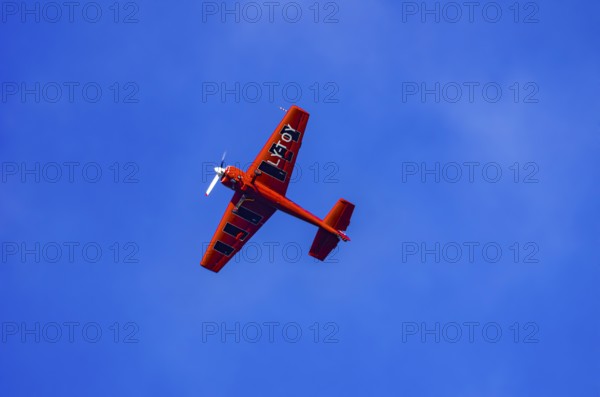 A Soviet Jakovlev Jak-55 sport aircraft with the registration LY-TOY during a flight demonstration as part of an air show on Rossfeld in Metzingen-Glems, Baden-Württemberg, Germany, for editorial use only