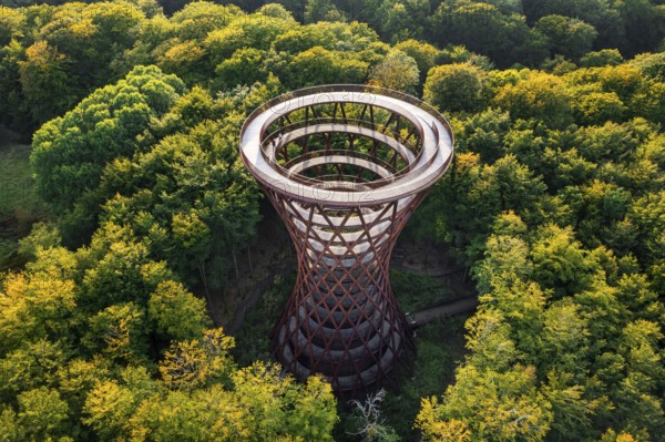 Aerial view over 45-meter-tall hyperboloid observation tower in forest near Gisselfeld monastery at Haslev on Zealand island in late summer, Denmark
