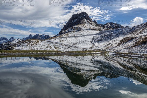 Kanzelwand is reflected in the reservoir, Kanzelwand snow-making pond, mountains of the Allgäu Alps behind, Vorarlberg, Austria