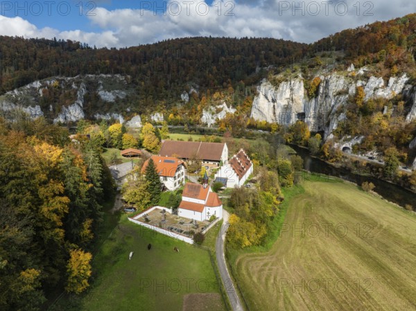 Aerial view of Käppeler Manor with St. George's Basilica near Thiergarten in the Upper Danube Valley, surrounded by autumn vegetation, Sigmaringen district, Baden-Württemberg, Germany