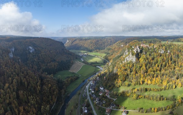 Aerial view, panorama of Werenwag castle and former castle on a rocky spur in the upper Danube Valley, surrounded by autumnal vegetation and clouds of fog, Sigmaringen district, Baden-Württemberg, Germany