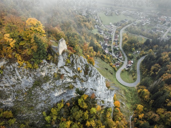 Aerial view of the viewpoint, shovels and Hausen Castle, also known as the Hausen ruins, surrounded by autumnal vegetation and clouds of fog, a ruin of a castle above the village of Hausen in the valley in the Upper Danube Valley, Beuron, Sigmaringen district, Baden-Württemberg, Germany