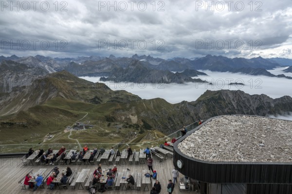 Restaurant at the Nebelhorn summit with views of the Allgäu Alps, mountains rising from fog in the valley, Oberstdorf, Oberallgäu, Allgäu, Bavaria, Germany