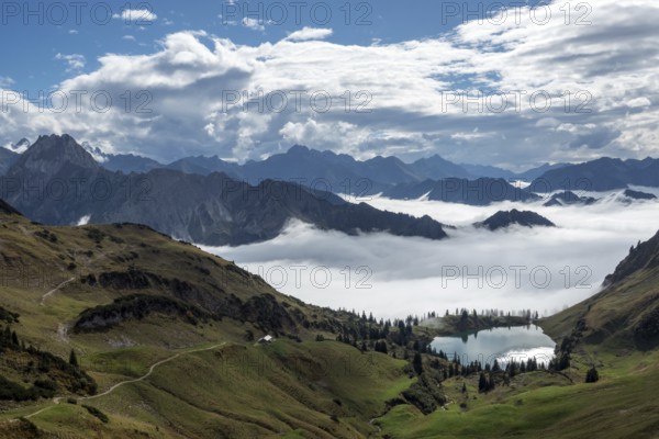 View of Seealpsee and Allgäu Alps, mountains rising from fog in the valley, Nebelhorn, Oberstdorf, Oberallgäu, Allgäu, Bavaria, Germany