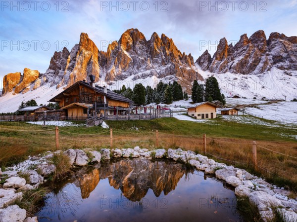 Geisleralm with Geisler Group in Alpenglühen, reflection, Dolomites, Santa Magdalena, Trentino, South Tyrol, Italy