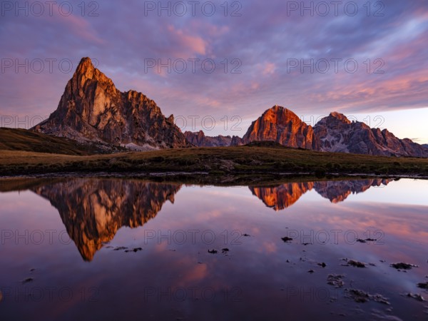 Alpine glow, reflection of the Ra Gusela and Tofane mountains at dawn, Passo di Giau, Giau Pass, Dolomites, Alps, Belluno province, Veneto region, Italy