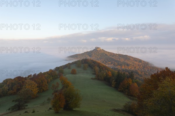 Hohenzollern Castle in a sea of fog at sunrise, autumn in the Swabian Jura