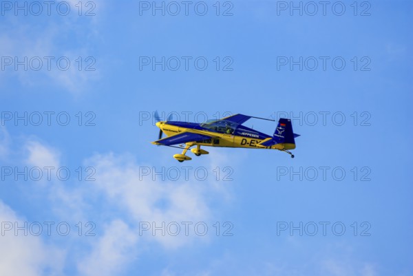 An Extra EA-300 of Extra Flugzeugproduktions- und Vertriebs GmbH with the registration D-EXBH during a flight demonstration as part of an air show at the Rossfeld in Metzingen-Glems, Baden-Württemberg, Germany, for editorial use only