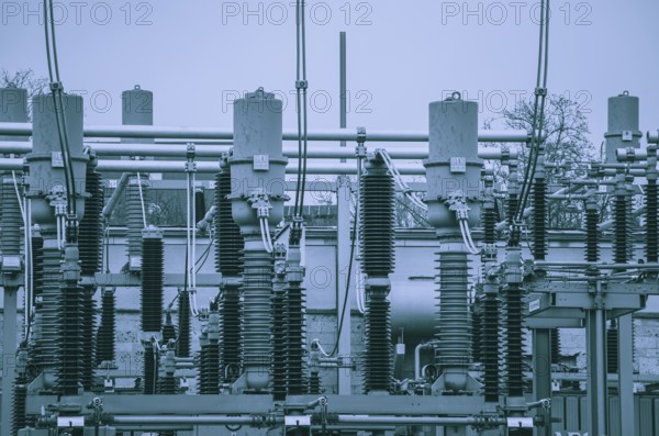 Concept of electricity and power generation using the example of insulators and devices in a substation