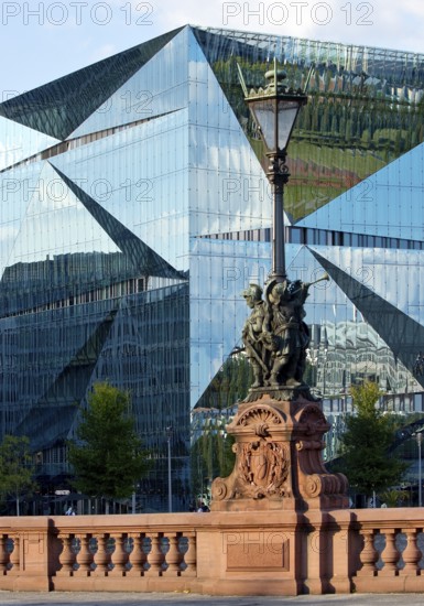 Historic Moltkebrücke with modern Cube Berlin, cube-shaped office building with glass façade reflecting the surroundings, Berlin, Germany