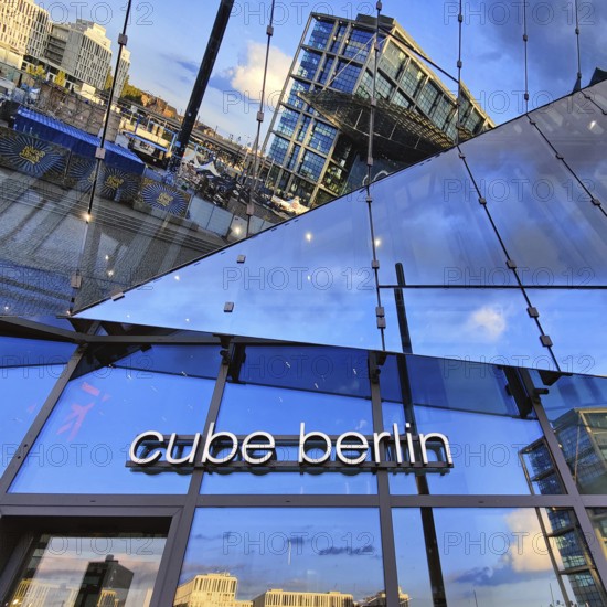 Cube Berlin, cube-shaped office building with inwardly folded glass façade reflecting the surroundings, Washingtonplatz, Berlin, Germany