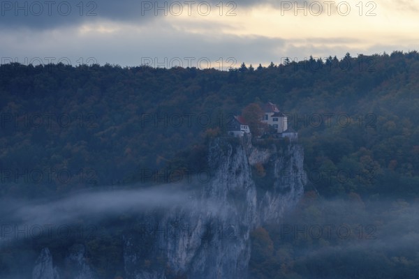 View from the Knopfmacherfelsen to Bronnen Castle, limestone rock, rock face, mixed forest, autumn colours, fog, autumn, Fridingen, Danube Valley, Upper Danube nature park Park, Baden-Württemberg, Germany