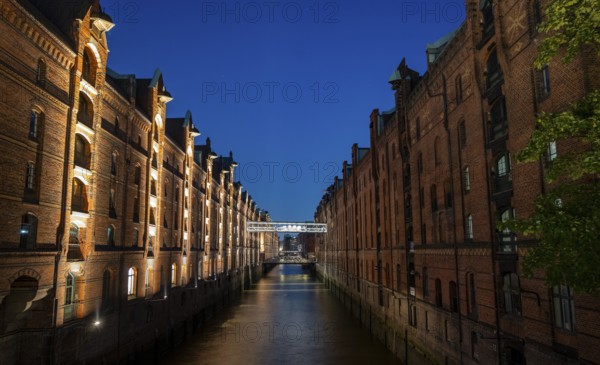 Illuminated warehouses in Hamburg's Speicherstadt, blue hour, Hamburg, Germany