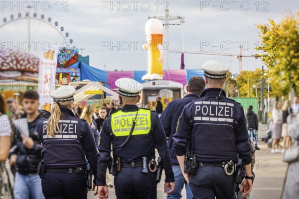 Police patrols at the funfair. The 178th Cannstatter Volksfest on the Wasen attracted 4.2 million visitors. The Wasenrummel is one of the most important traditional festivals in Germany. Bad Cannstatt, Stuttgart, Baden-Württemberg, Germany