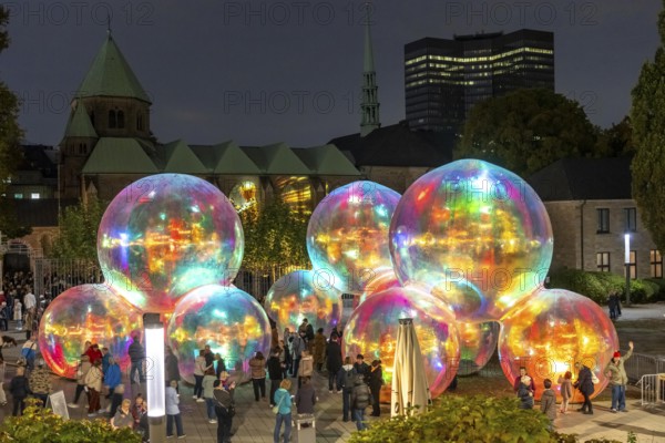 The 10th Essen Light Festival, in the city centre, second largest light art festival in Germany, light art on the Burgplatz, Evanescent light installation, by the Australian artist duo Atelier Sisu, large bubble-like spheres, with light and sound, town hall, cathedral, Essen, North Rhine-Westphalia, Germany