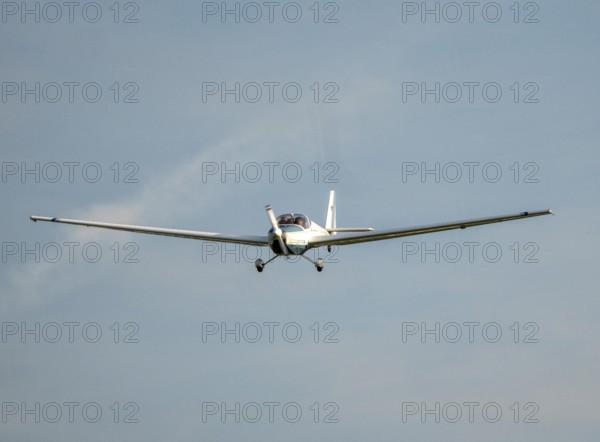 SF-25C Rotax Falke disc motor glider flying over Düsseldorf Airport, North Rhine-Westphalia, Germany