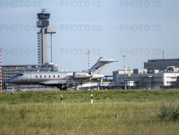 Private jet of the type Bombardier Challenger 350, of the private airline VistaJet, during take-off at Düsseldorf Airport, North Rhine-Westphalia, Germany